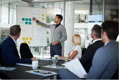 Professional executive presenting data during a job interview
